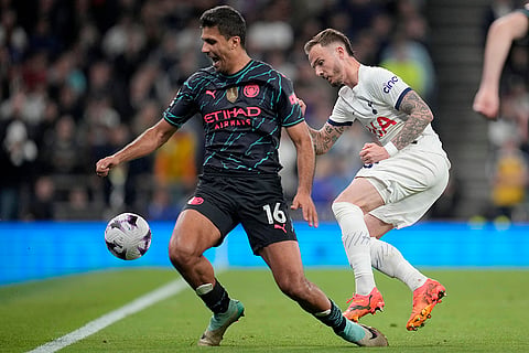 Rodrigo, left, duels for the ball with James Maddison